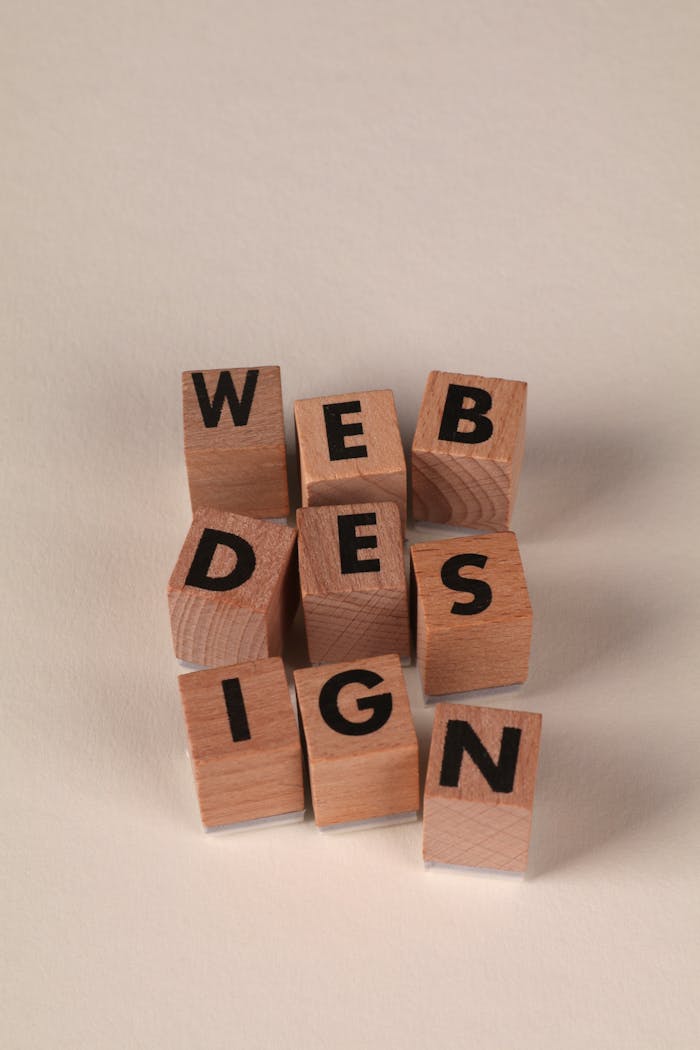 gallery-1 Wooden blocks arranged to spell 'Web Design'. Perfect for creative, digital content themes.
